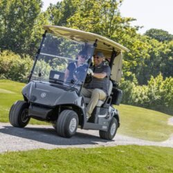 Yamaha Golf Cart with Golf Clubs with couple driving