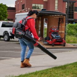 60V MAX Revolution Electric Battery Backpack Leaf Blower Cannon action shot