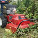 Close-up of Toro Brush Cutter BRC-28 in action, clearing dense brush and overgrown grass