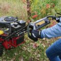 Close-up of the Toro Brush Cutter BRC-28 control panel being operated during brush cutting