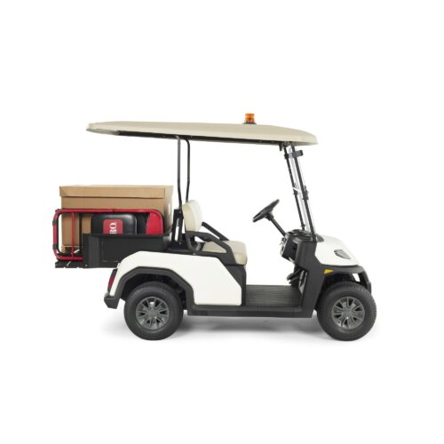 Utility-focused Toro Vista vehicle side view featuring a black cargo bed attachment for efficient hauling