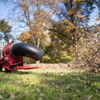 Ventrac Turbine Blower Attachment - blowing leaves in a public park