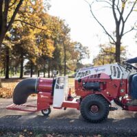 Ventrac Turbine Blower Attachment - driving through a public park