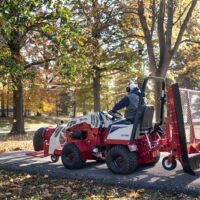 Ventrac Turbine Blower Attachment - blowing leaves in a public park