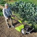 Tending to garden using a walking tractor