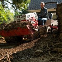 Ventrac Power Bucket 48" Tractor Attachment - collecting construction rubble