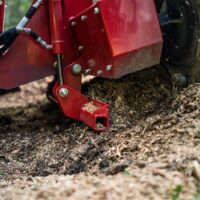 Ventrac 22" Stump Grinder Tractor Attachment - close up as attachment grinds a stump