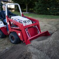 Ventrac Versa Loader Attachment - digging through garden