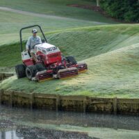 Ventrac Triplex Reel Mower Attachment - mowing golf grounds (slope by water_