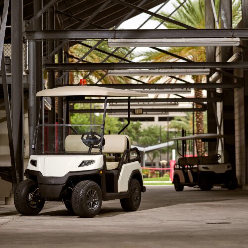 Toro Vista utility vehicle parked in a covered facility, featuring durable construction for industrial use