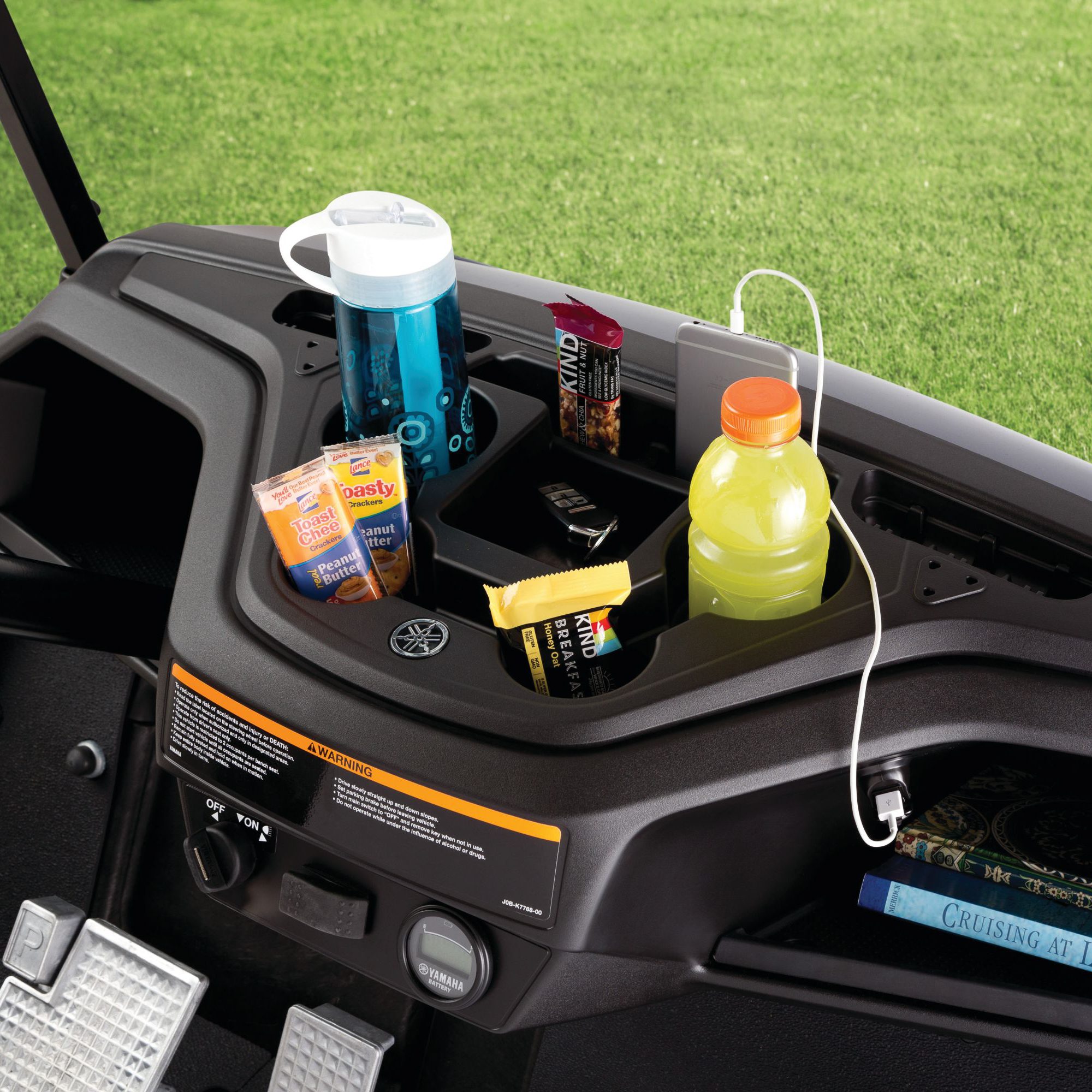 Yamaha central console on a golf cart. Eco charging ports