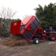 Sweeper clearing debris off golf course