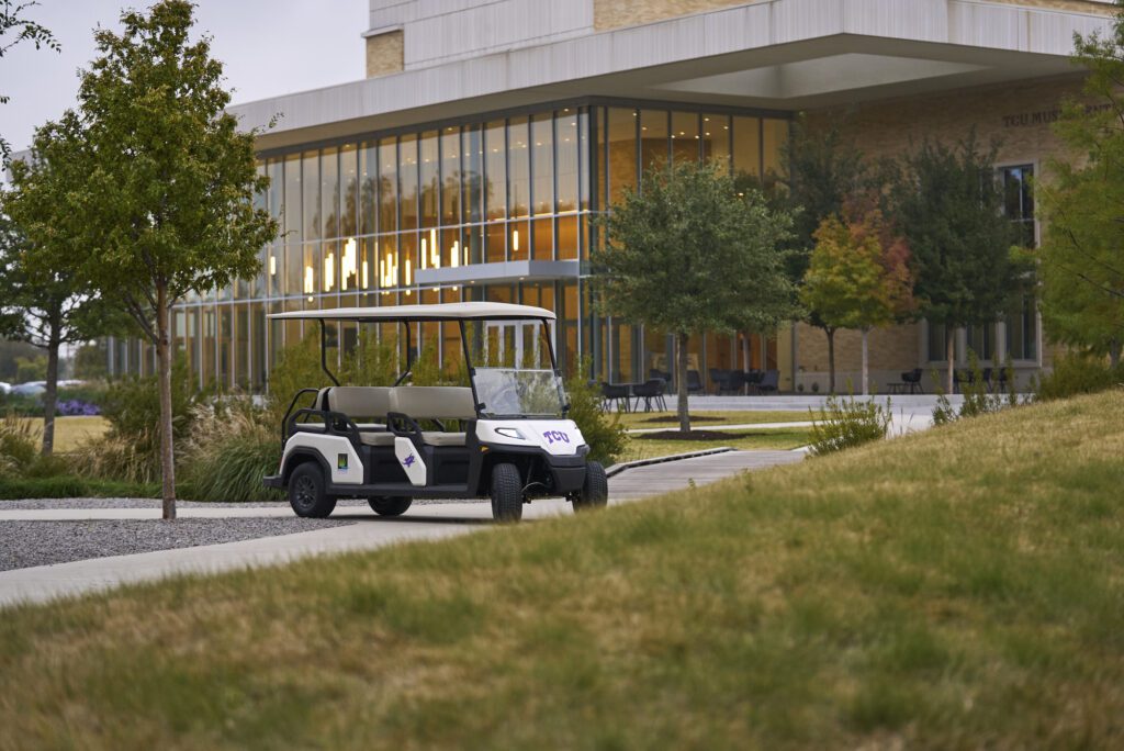 Toro Vista Passenger Transport Vehicle parked in a university courtyard